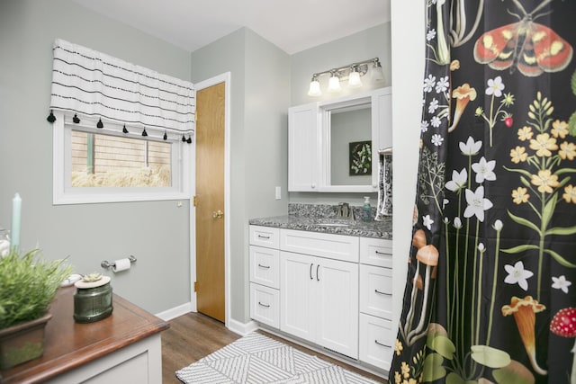 bathroom with vanity and hardwood / wood-style floors