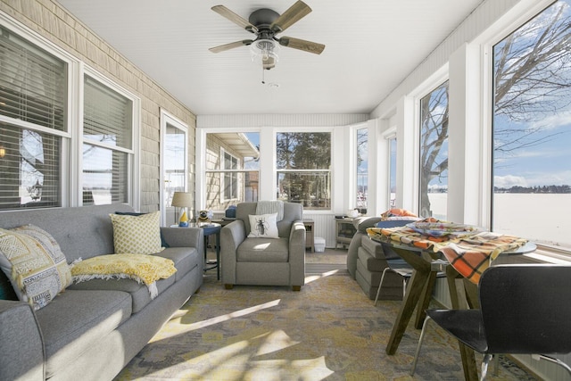 sunroom featuring plenty of natural light and ceiling fan