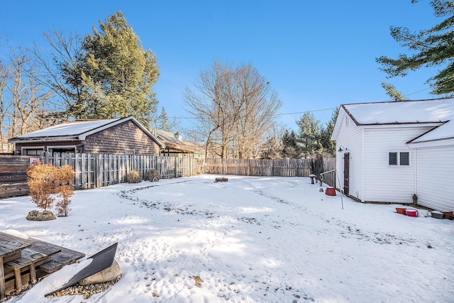 view of yard layered in snow