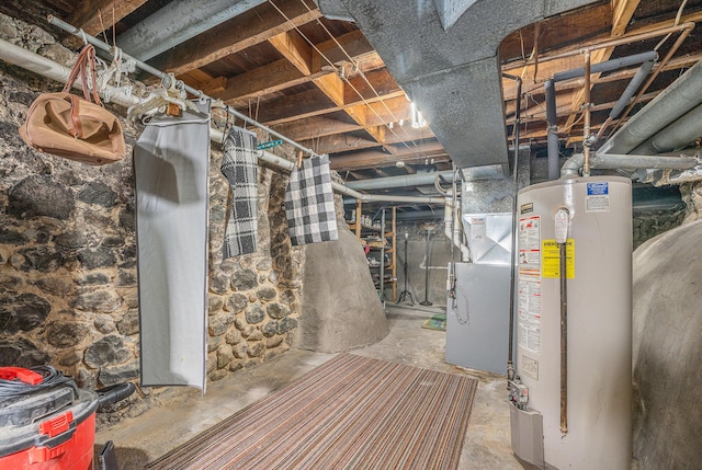 basement featuring heating unit and water heater