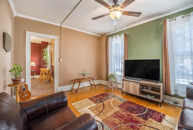 living room featuring crown molding, ceiling fan, and hardwood / wood-style floors