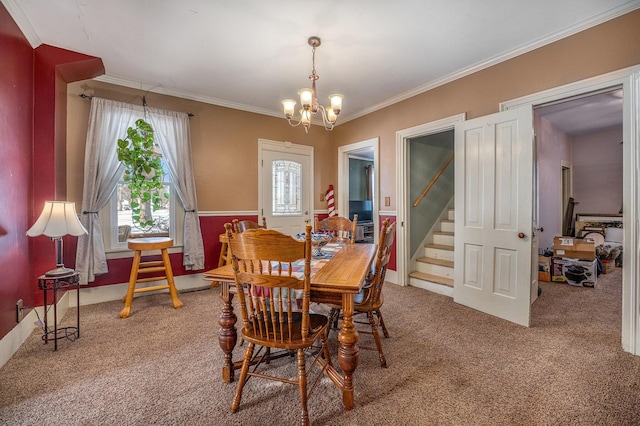 carpeted dining area with ornamental molding and a notable chandelier