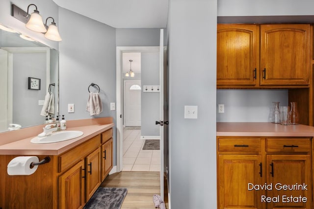 bathroom with tile patterned flooring and vanity