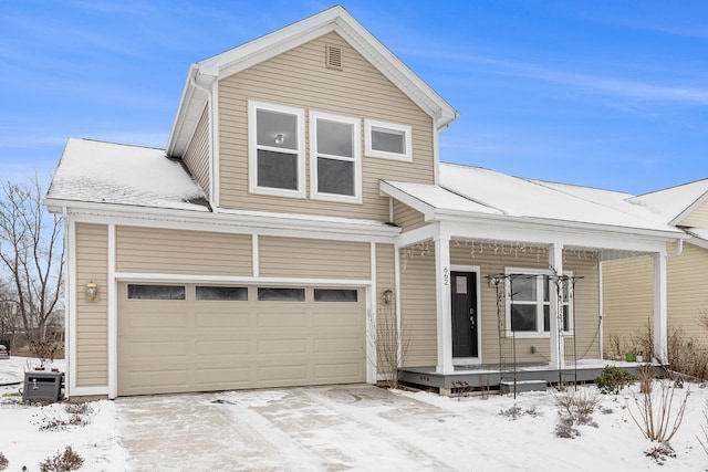 view of front of property featuring a garage and a porch