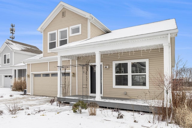 view of front of property with a garage and a porch