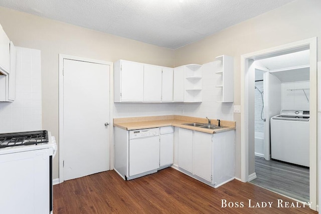 kitchen with white cabinetry, washer / dryer, sink, dark hardwood / wood-style flooring, and white dishwasher