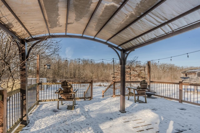 view of snow covered deck