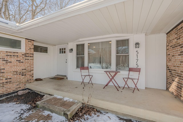 view of snow covered property entrance