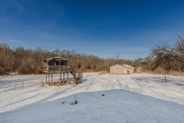 view of yard covered in snow