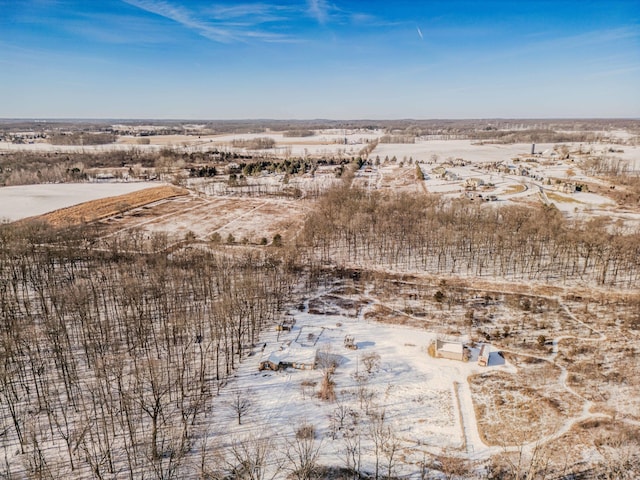 snowy aerial view featuring a rural view