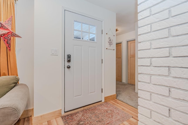 entryway with light hardwood / wood-style flooring