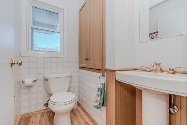 bathroom featuring hardwood / wood-style flooring and toilet