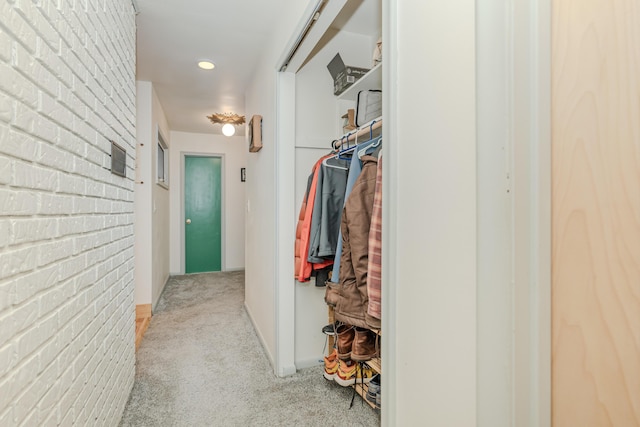 spacious closet with light carpet