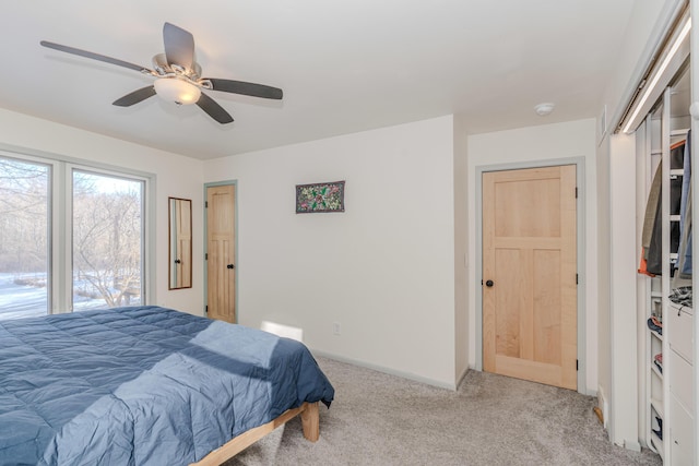 bedroom with light carpet and ceiling fan