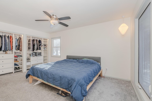 bedroom featuring ceiling fan and carpet