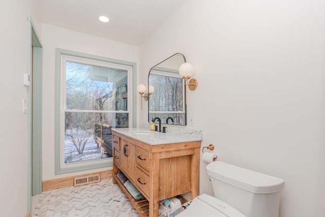 bathroom with vanity and toilet