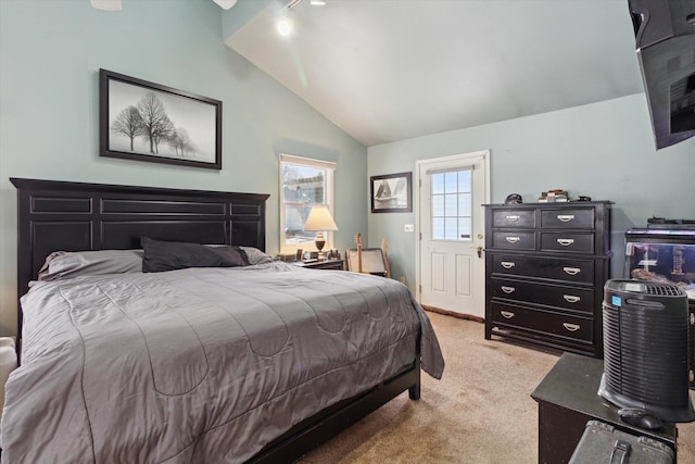 bedroom featuring vaulted ceiling and light colored carpet