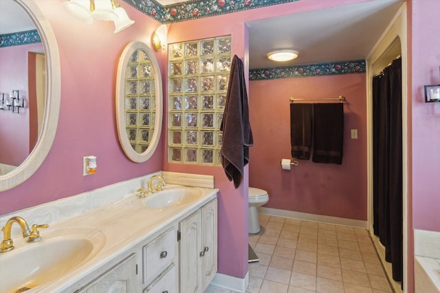 bathroom with vanity, tile patterned floors, and toilet