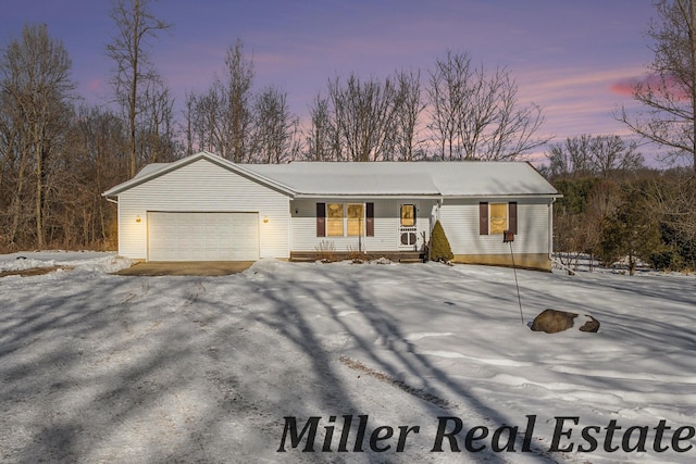 ranch-style home with a garage