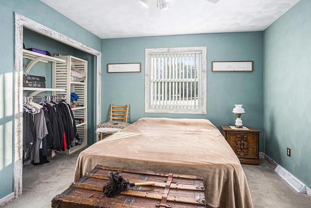 bedroom with carpet floors and a closet