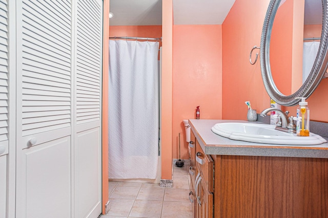 bathroom featuring vanity, shower / tub combo, and tile patterned floors