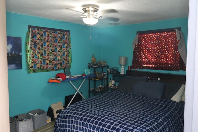 bedroom featuring a textured ceiling and ceiling fan