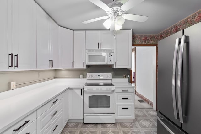 kitchen featuring ceiling fan, white appliances, and white cabinets