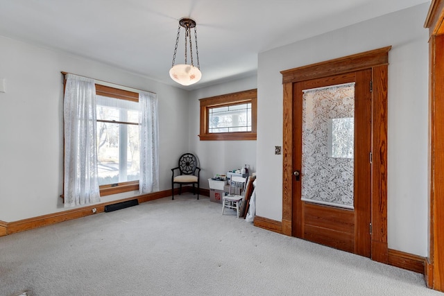 view of carpeted foyer