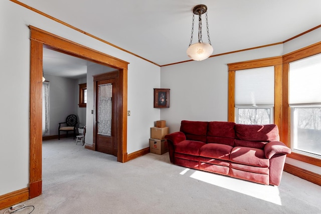 carpeted living room with ornamental molding