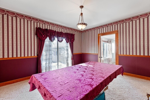 carpeted bedroom with multiple windows