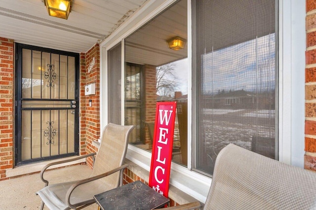 entrance to property with brick siding