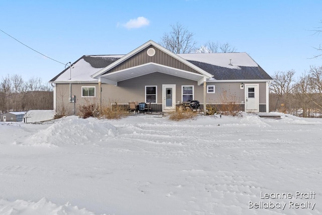 view of snow covered house