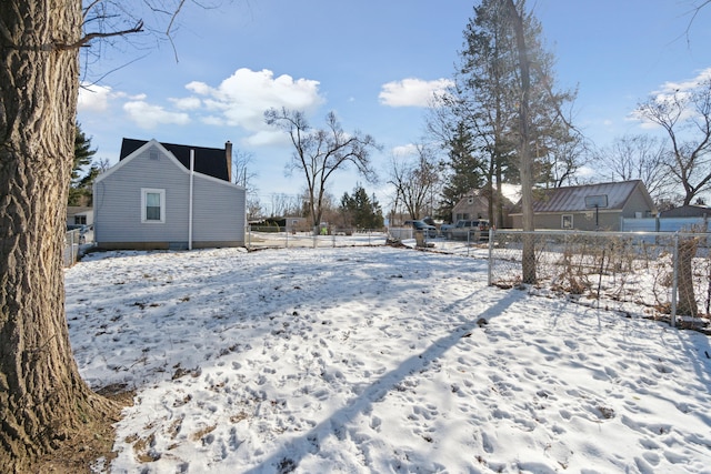 view of yard layered in snow