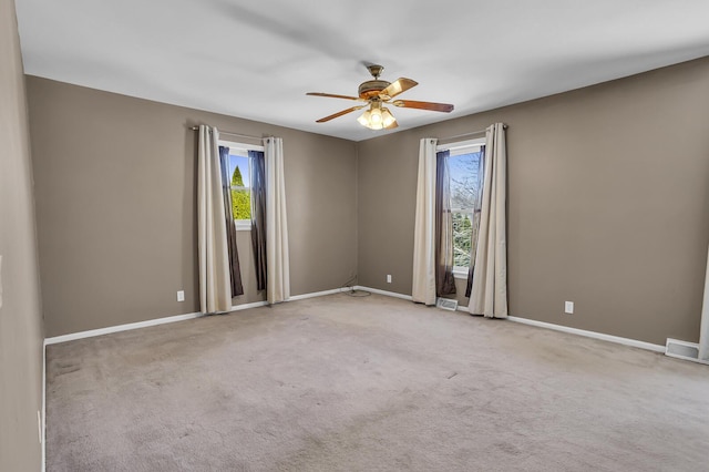 carpeted empty room with ceiling fan