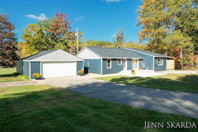 ranch-style home with a garage and a front lawn