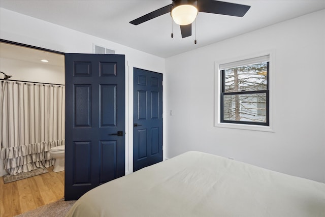 24112 N Shore Dr, Edwardsburg, MI 49112 - bedroom featuring wood finished floors, ceiling fan, and visible vents