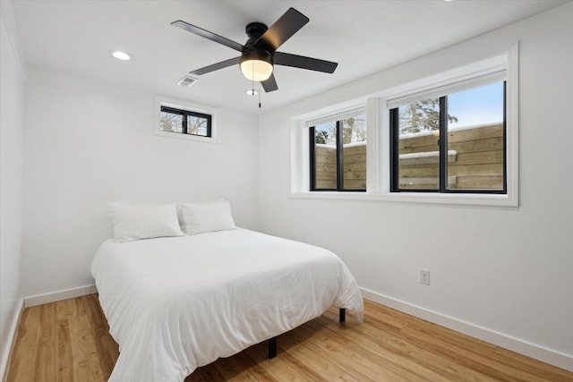 24112 N Shore Dr, Edwardsburg, MI 49112 - bedroom featuring recessed lighting, baseboards, visible vents, ceiling fan, and wood finished floors