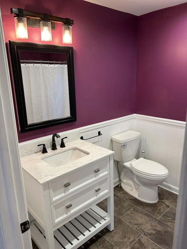 bathroom with vanity and toilet