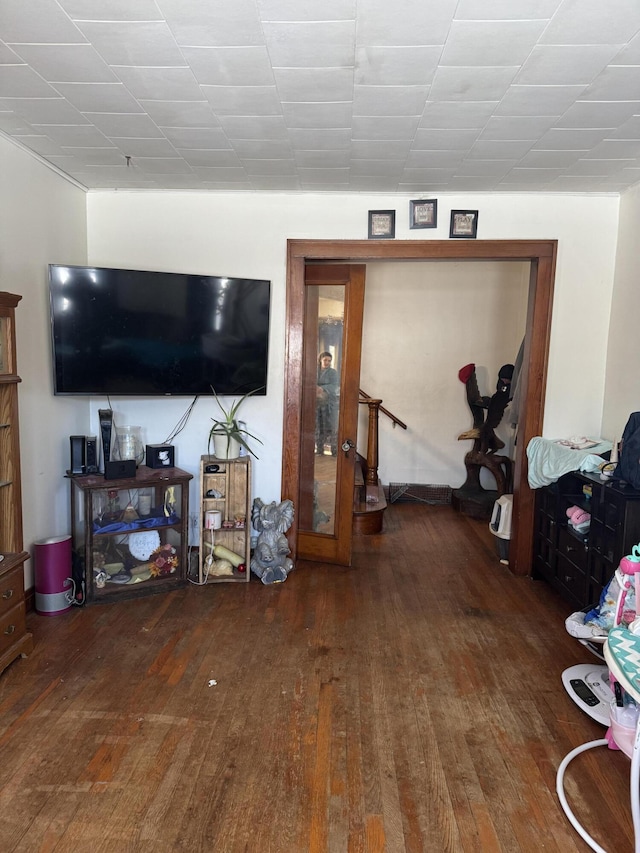 living room with dark hardwood / wood-style flooring