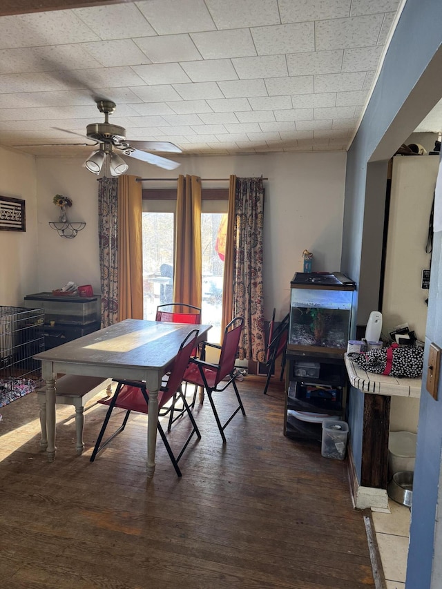 dining area featuring hardwood / wood-style floors and ceiling fan