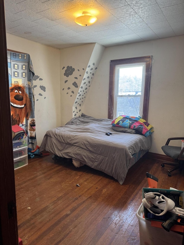 bedroom featuring wood-type flooring