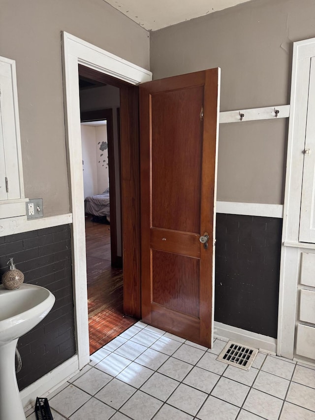 bathroom with tile patterned floors