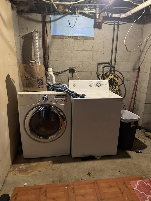 clothes washing area featuring washing machine and clothes dryer