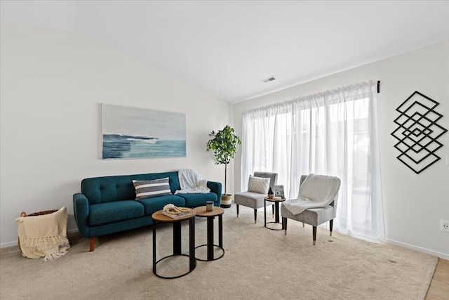 living room featuring lofted ceiling