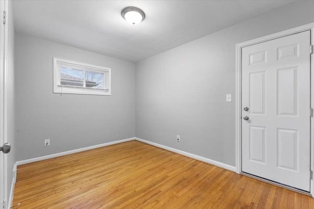 spare room featuring light wood-type flooring