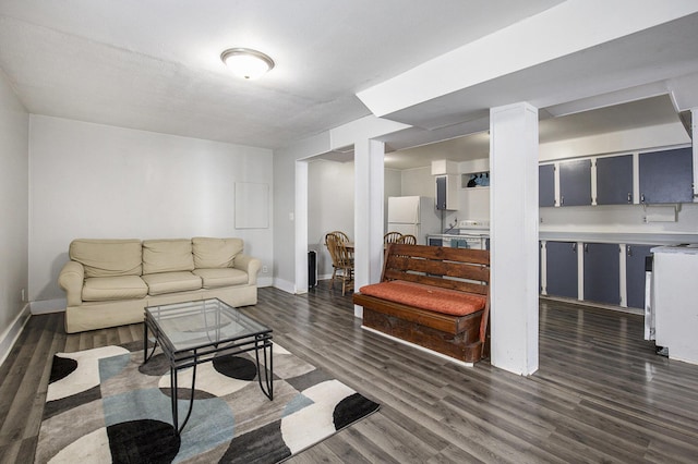 living room with dark hardwood / wood-style floors