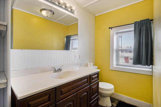 bathroom with vanity, plenty of natural light, and toilet