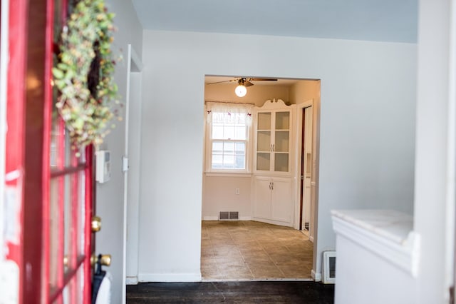 entrance foyer featuring ceiling fan and dark hardwood / wood-style floors