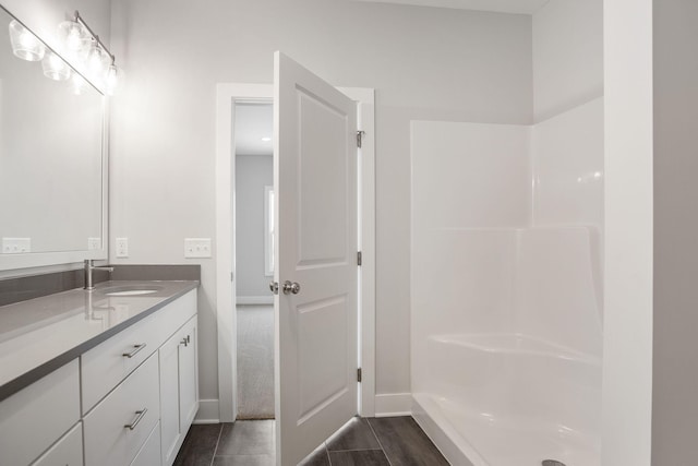 bathroom featuring vanity and walk in shower