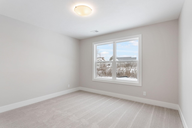 spare room featuring carpet flooring